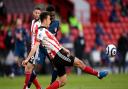 Sheffield United's Ethan Ampadu clears the ball under pressure from Arsenal's Bukayo Saka during the Premier League match at at Bramall Lane, Sheffield. Picture date: Sunday April 11, 2021.