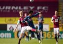 Burnley's Ben Mee (left) and Arsenal's Willian (right) battle for the ball during the Premier League match at Turf Moor, Burnley. Picture date: Saturday March 6, 2021.