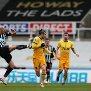 Newcastle United's Jonjo Shelvey and Tottenham Hotspur's Gareth Bale battle for the ball during the Premier League match at St James' Park, Newcastle. Picture date: Sunday April 4, 2021.