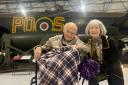 Stuart Black with wife Crystal next to a Lancaster bomber at RAF Museum London