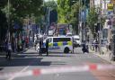 Police at the scene in Ealing in west London on July 24, after a man was stabbed to death inside a pub