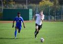 A Sporting Bengal United player and Hoddesdon Town player compete for the ball (pic: Tim Edwards).