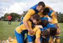 Sporting Hackney players bundle Sion Jones after his winning goal (pic: Peter Harrington).