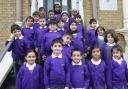 Olive free school pupils on the steps of their current school in 2020.