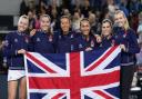 Great Britain pose with the Union Jack flag after beating Sweden in the Billie Jean King Cup play-off at the Copper Box Arena. Image: PA