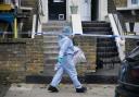 Forensics outside the house in Montague Road, Hackney