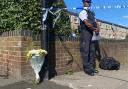 Flowers laid near where a man, 38-year-old Jade Anthony Barnett, was stabbed to death in Rushmore Road, Clapton