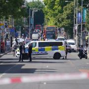 Police at the scene in Ealing in west London on July 24, after a man was stabbed to death inside a pub