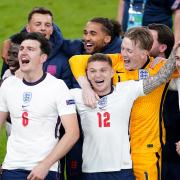 England's Reece James, Bukayo Saka, Harry Maguire, Kieran Trippier, Jordan Pickford, Jack Grealish and team-mates celebrate winning the UEFA Euro 2020 semi-final match at Wembley on July 7