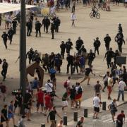 French riot police move in to arrest Russian fans after violence broke out between supporters ahead of the England vs Russia France Euro 2016 match, in Marseille, France. Photo: Niall Carson / PA