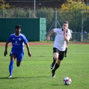 A Sporting Bengal United player and Hoddesdon Town player compete for the ball (pic: Tim Edwards).