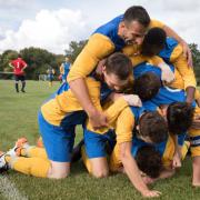 Sporting Hackney players bundle Sion Jones after his winning goal (pic: Peter Harrington).