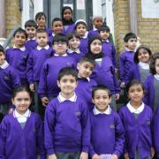 Olive free school pupils on the steps of their current school in 2020.