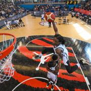 New City College student Josiah Philip attacks the basket