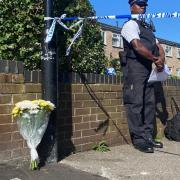 Flowers laid near where a man, 38-year-old Jade Anthony Barnett, was stabbed to death in Rushmore Road, Clapton