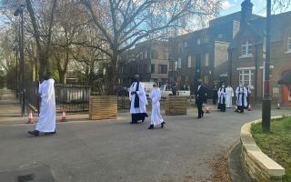 A procession enters St John at Hackney Church to commemorate the life and service of Prince Philip.