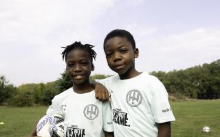 Young Hackney Wick FC members wearing the 'It's not a game' top to raise awareness of prostate cancer